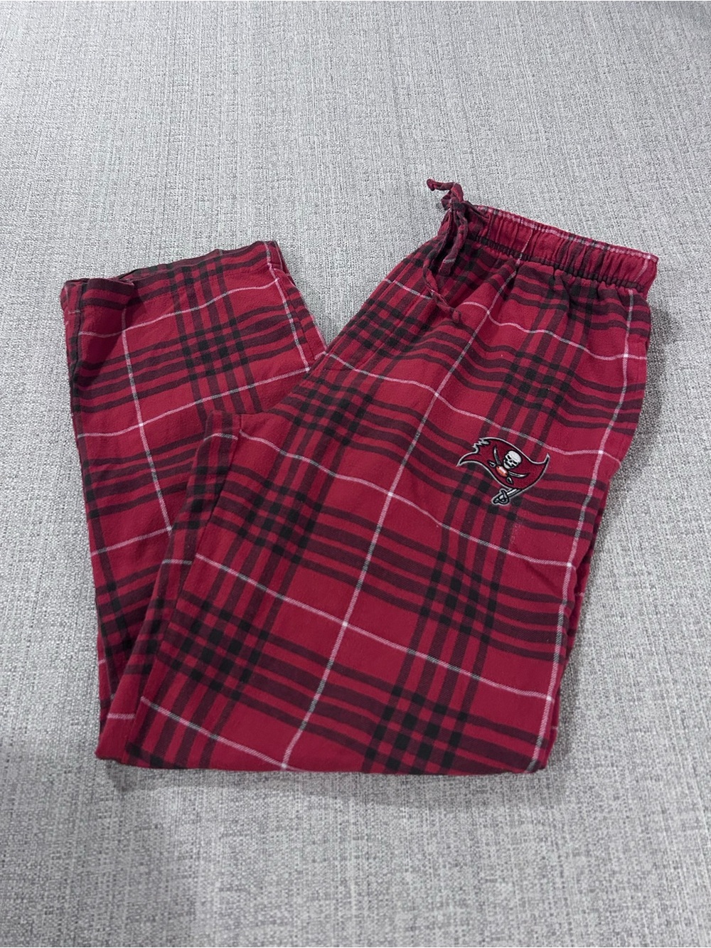 Red Plaid Pajama Bottom Pants with the Tampa Bay Bucs Logo.  Size L